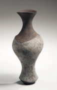 Elongated vase with flared mouth and enlarged center