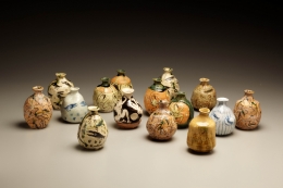 Set of 15 unique sake flasks in oribe glaze, ca. 1995