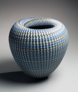 Standing, conical, neriage (marbleized) vessel in blue, gray and white with carved, pleated surface and rolled-in mouth, 2016
